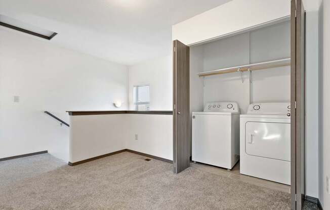 A laundry room with a washer and dryer in it.