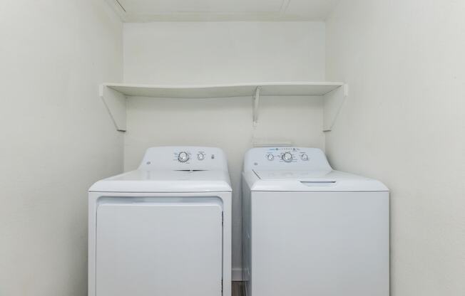 a laundry room with a washer and dryer