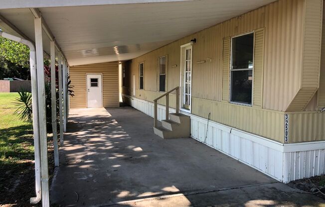 CUTE (2BR/1BA) Wesley Chapel Mobile Home w/Carport! Water, Sewer & Trash Included with Rent!