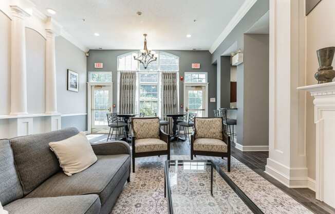 a living room with a couch and a glass table