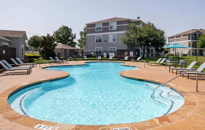 our apartments have a large swimming pool with lounge chairs