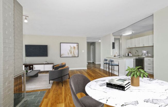 Open concept living room with fireplace and kitchen