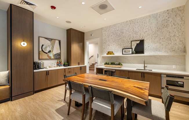 a kitchen and dining room with a wooden table