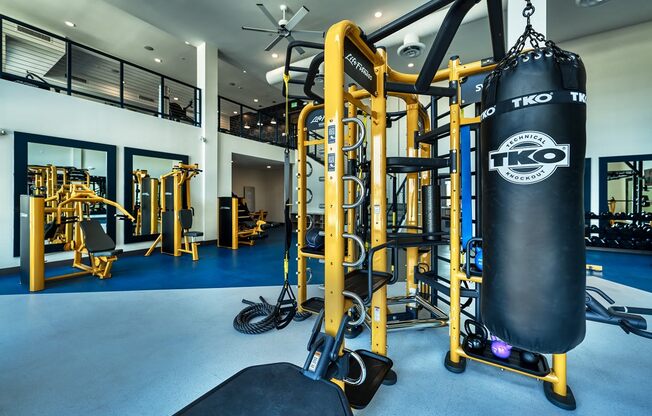 Two-story fitness center with free weights and punching bag at Cuvee, Glendale, 85305