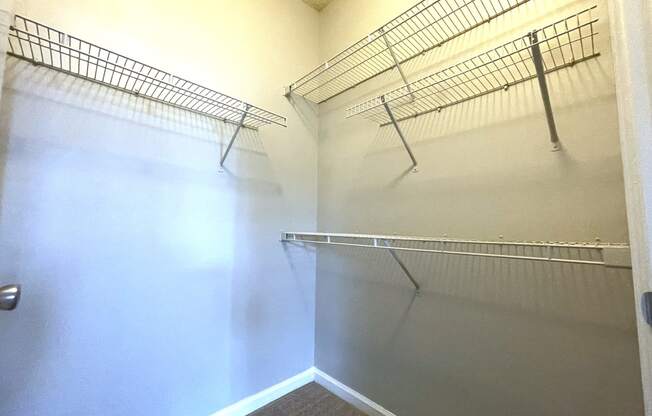 Walk in closet with shelves and a white wall at The Chase, Burlington North Carolina