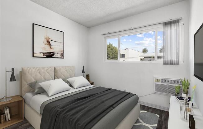 a bedroom with a large bed and a large window at Pacific Rose, Los Angeles