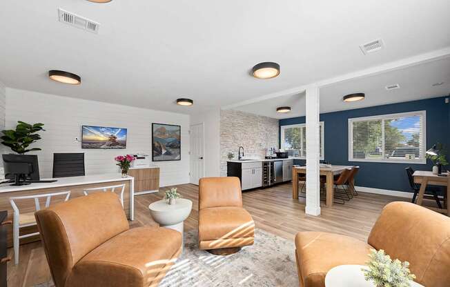 A living room with brown leather chairs and a white table.