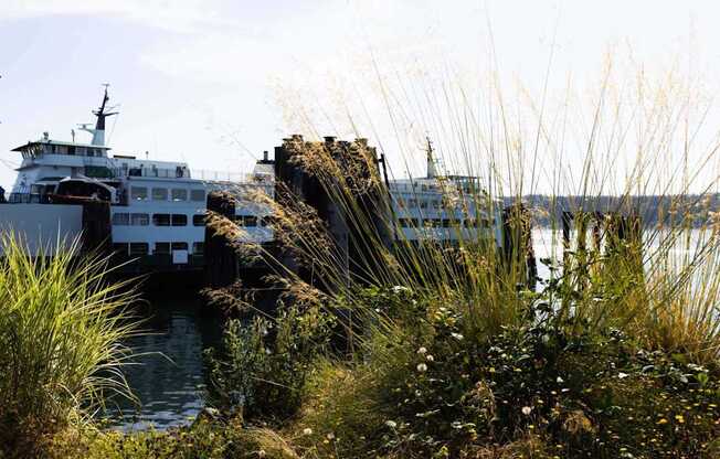 A large white boat is docked at a pier at Spyglass Hill Apartments, Bremerton, 98337