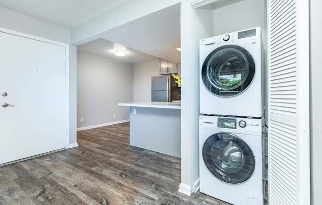 a kitchen with a refrigerator and a microwave