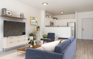 a living room with a blue couch and a television