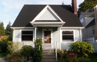 Charming Tudor with Large Fenced Yard in Fabulous Maple Leaf Location