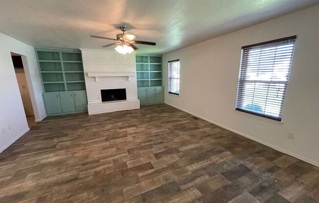 3 bed 2 bath with covered patio, wood ceramic flooring, new paint all updated with a fenced yard in Moore Schools!