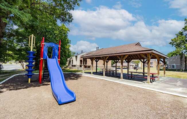 Playground with shaded pavilion at  Woodbridge Apartments