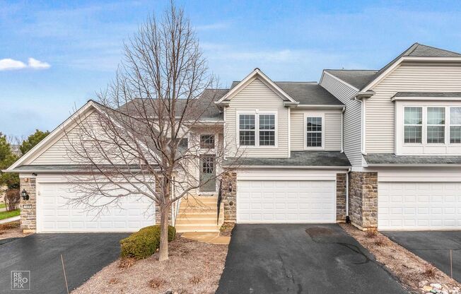 AUTUMN CREEK SECOND FLOOR CONDO WITH TWO CAR GARAGE
