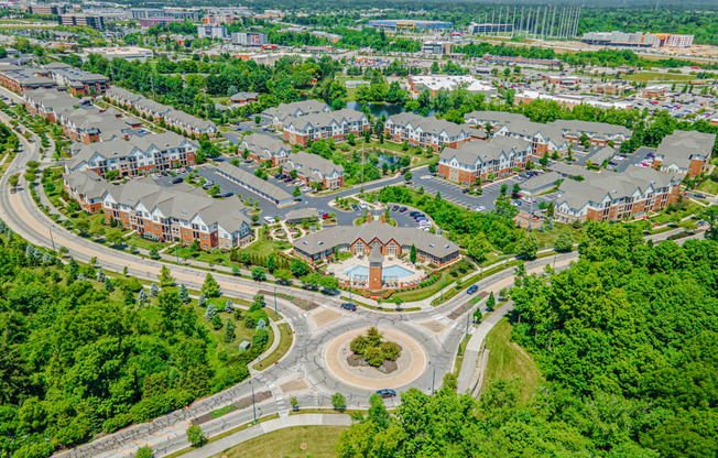 an aerial view of a neighborhood with houses and trees