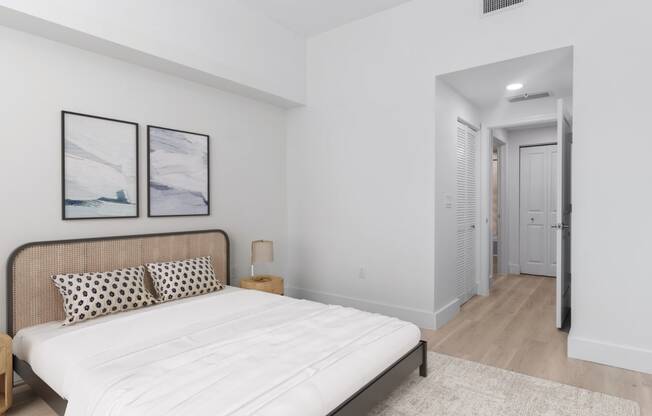 a bedroom with a large bed and a closet at One Plantation in Plantation, FL 33324