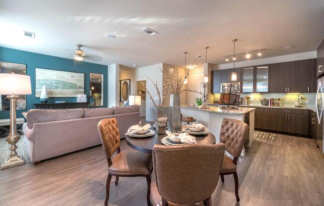 a living room filled with furniture and a large window