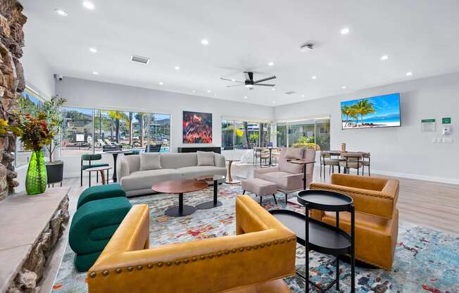 A living room with a yellow chair and a green chair.