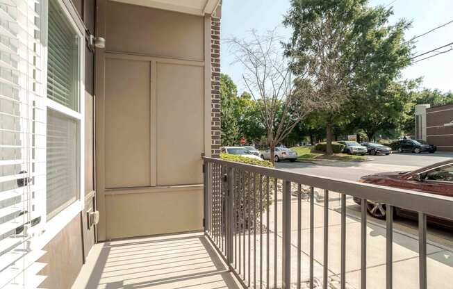 a balcony with a view of a parking lot