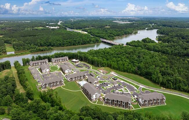 an aerial view of a campus with a river