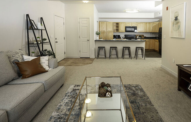 Open Living Room with Kitchen View at Four Seasons at Southtowne Apartments, South Jordan, UT, 84095