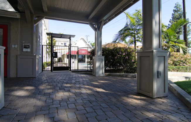 A gate with a metal railing is closed.