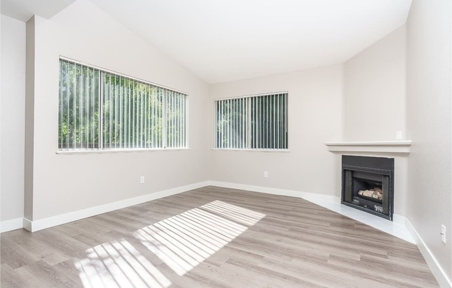 renovated floorplan with fireplace and plank style flooring