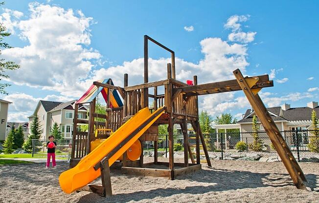 a playground with a slide and monkey bars