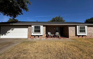 Stunning updated Three bedroom home with sunroom.