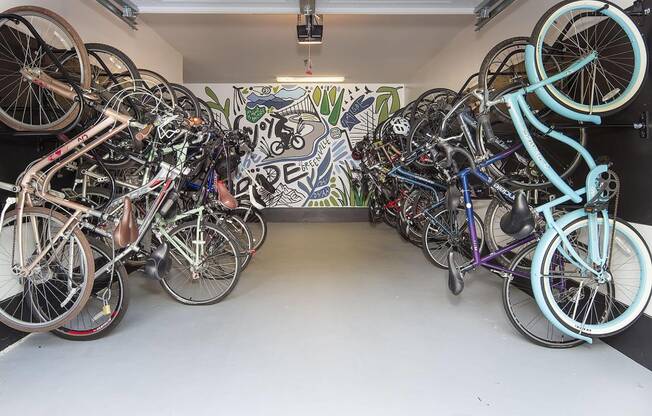 a bunch of bikes parked in a room