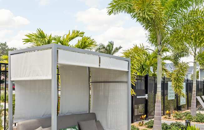 a patio with a couch and a canopy at Palm Grove in Ellenton, FL 34222