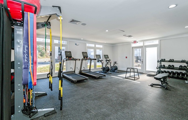 fitness center with free weights and cardio equipment