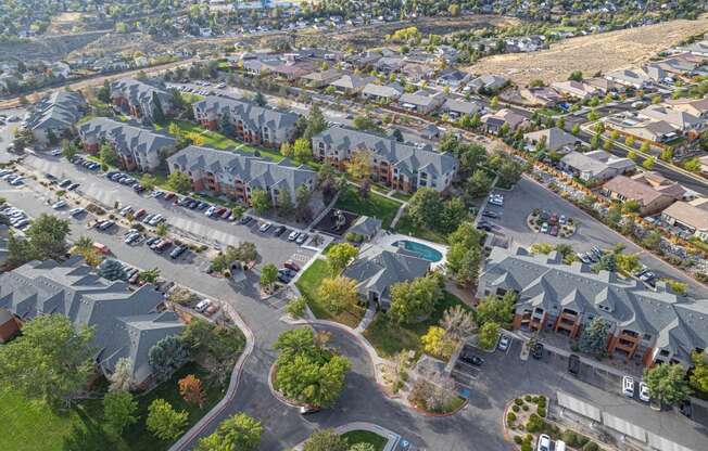 an aerial view of a neighborhood with houses and cars