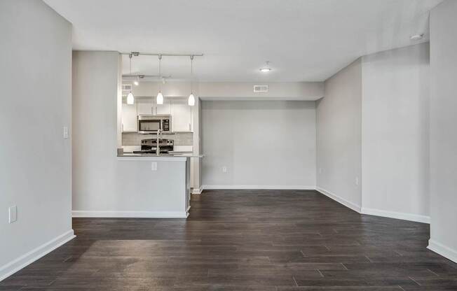 A kitchen area with a counter and a microwave.