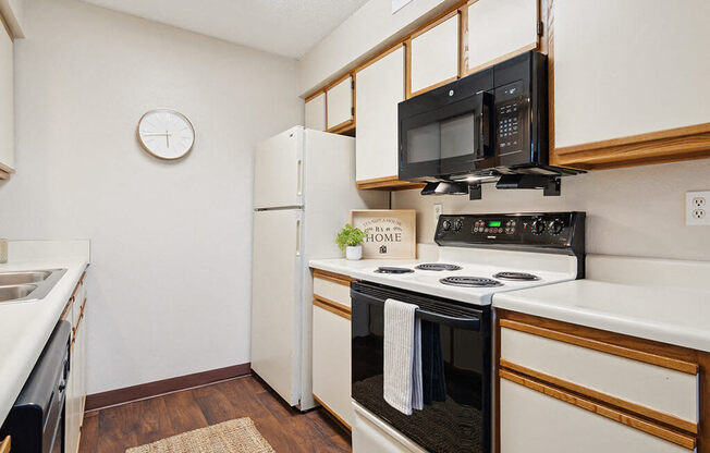a kitchen with a stove and a microwave