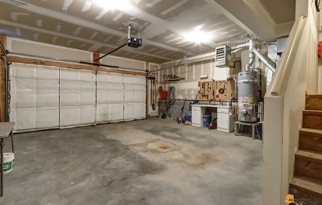 East Anchorage Condo with Fenced in Yard, W/D in unit, & 2 Car Garage! Close to JBER, Baxter Bog Park, and Baxter Elementary School.