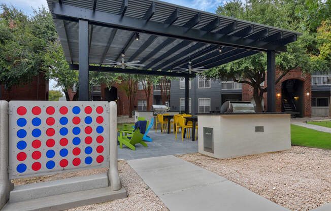 An outdoor lounge area with yard games.
