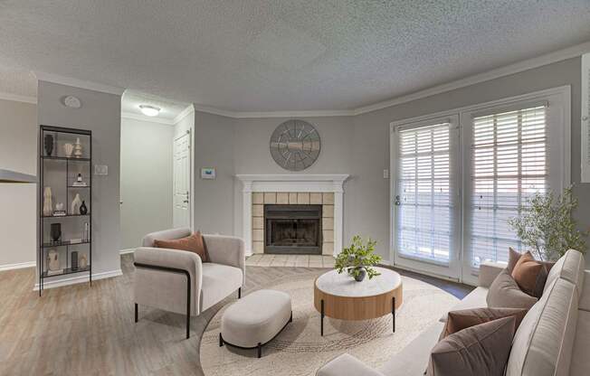 A living room with a fireplace and a clock on the wall.