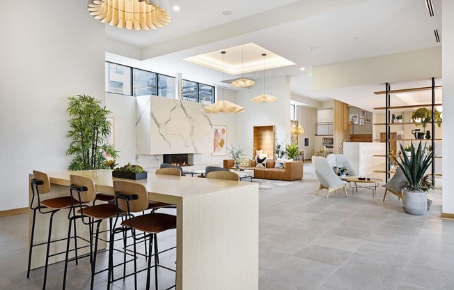 A modern living room with a bar area and a fireplace.