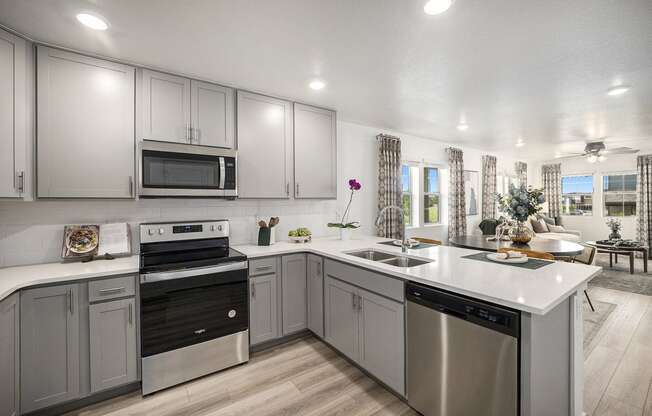 Kitchen with stainless steel appliances and quartz counter tops