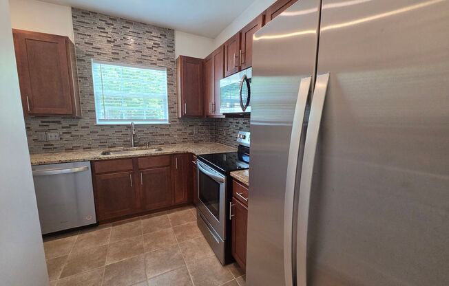 Beautiful 1 Bed/1 Bath Condo - Open Floor Plan - Large Kitchen - Covered Balcony - Community Pool - Secured Building