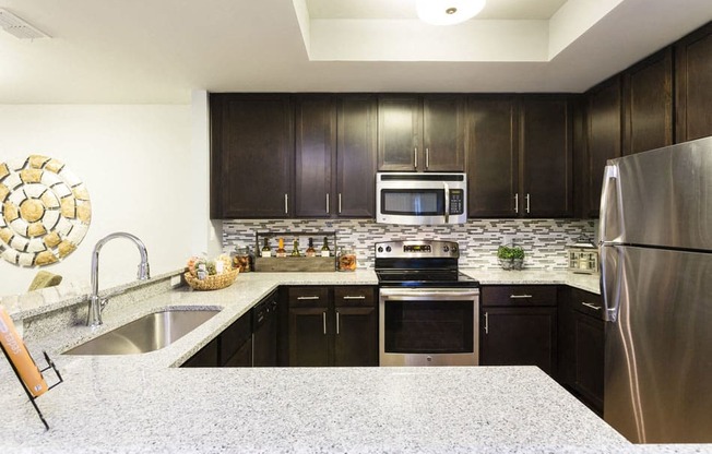 Channelside apartments in Fort Myers, Fl photo of Gourmet Kitchen w/ Modern Appliances