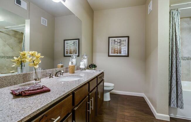 a view of a staircase from the top of a building with stairs and a mirror at Platinum Castle Hills, Lewisville, 75056