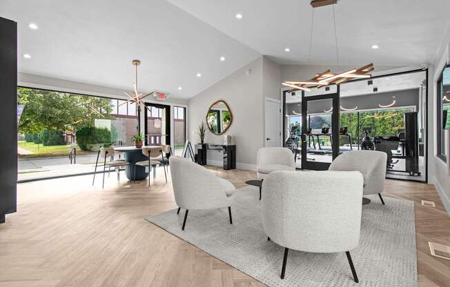 A modern living room with a large window and a view of the outdoors.