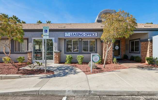 A building with a sign that says Leasing Office.