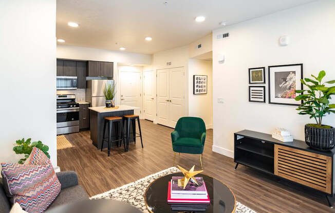 a living room and kitchen with a dining area and a table