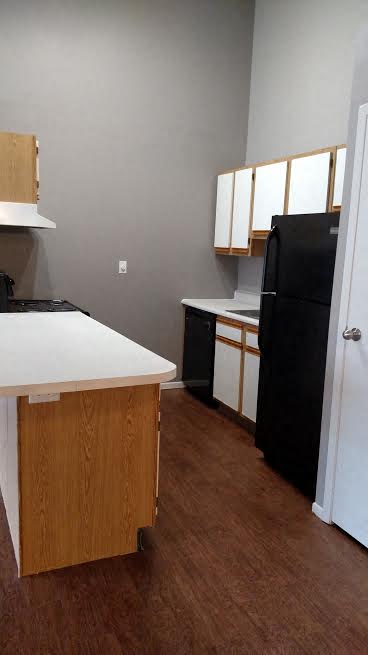 Image of kitchen with cabinets and appliances