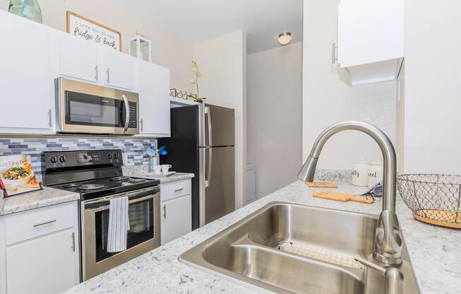 a kitchen with a stove and a sink