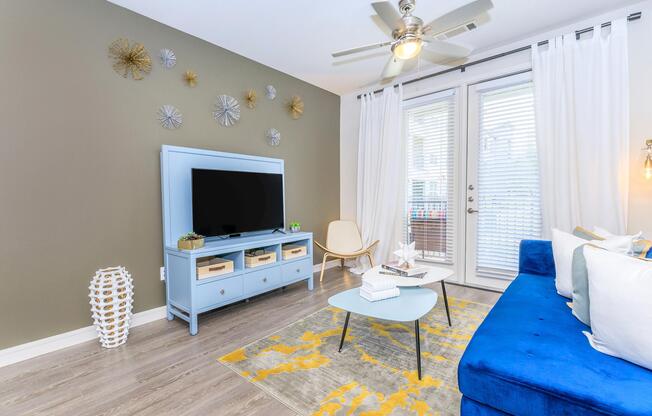 a bedroom with a bed and desk in a room