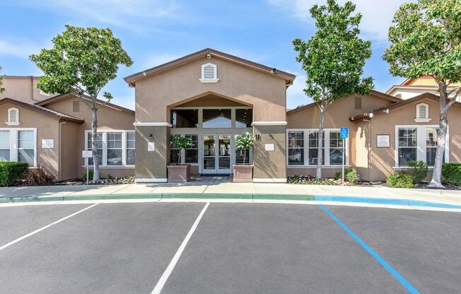 an empty parking lot in front of a house